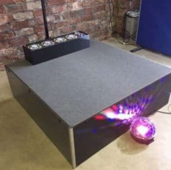 Conductor Podium - Speaker podium, camera podium. This stage podium package offers a very quick setup podium to elevate your conductor, camera equipment, single speaker, or musician. Takes 30 seconds to assemble. Comes in tough top or carpet finish and 300mm riser. No locks or keys. Watch the Video! Add 4m of  Valance Skirting for
