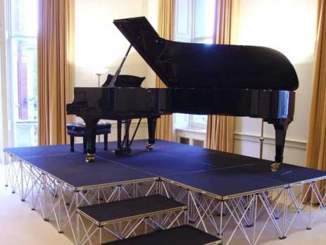 Imagine you're organising a primary school performance. Thirty children, several teachers, musical instruments and a heavy piano are all using the same portable stage. The stage may look perfectly stable, but there's more to stage load capacity than simply adding up everyone's body weight. A stage has to support people, equipment and other loads through its stage load capacity